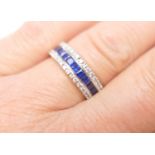 Diamond and sapphire half eternity ring in 18ct yellow gold, channel set with twelve cushion cut