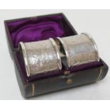 Pair of Victorian silver napkin rings, London 1882, cased, gross weight 62g