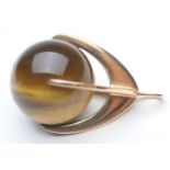 Continental 14ct gold tiger's eye fob or pendant, spherical stone within a four claw mount, 33mm,