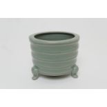 Chinese celadon censer, 20th Century, fluted cylinder form raised on three feet, height 8.5cm, 11.