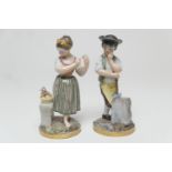 Pair of continental hard paste porcelain figures modelled as a stone mason and a girl winding