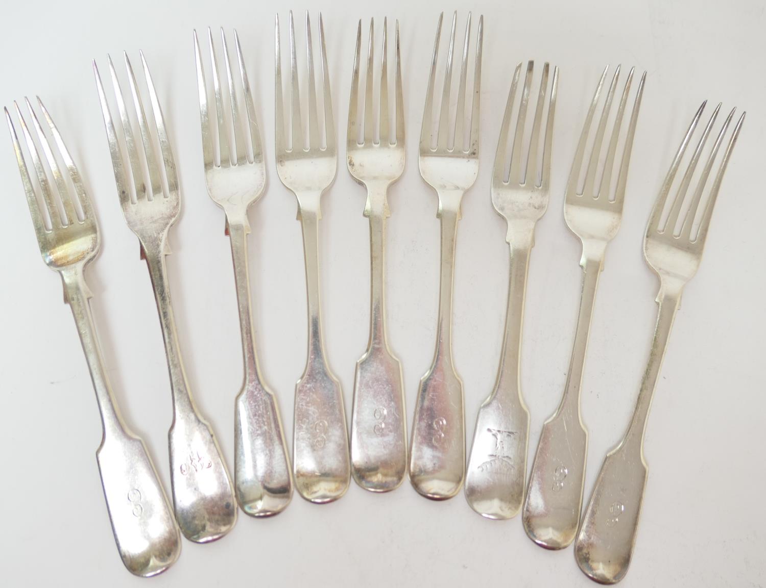 Silver fiddle pattern table forks, various makers and dates, comprising four by William Eaton,
