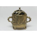 Japanese polished bronze censer, cylinder form with pierced cover, cast with bamboo and with