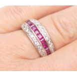 Diamond and ruby half eternity ring in 18ct white gold, channel set with twelve cushion cut rubies