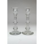 Pair of quality cut glass candlesticks, having multi-knopped columns with wrythen slice cuts, over a