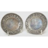 Pair of Tiffany & Co. sterling silver coasters, circa 1900-20, with foliate border centred with a