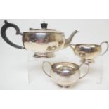 George VI silver three piece tea service, maker G.B & Co., Birmingham 1945/46, plain bun form, the