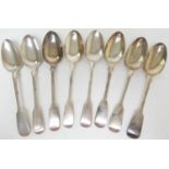 Three George III silver fiddle pattern dessert spoons, makers' marks rubbed, London 1811; also a