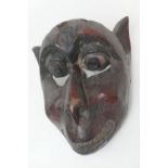 Baule, Ivory Coast, carved wooden monkey mask, with traces of painted decoration, 31cm