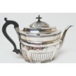 George III silver teapot, maker's mark indistinct, London 1800, of half reeded form with ebony