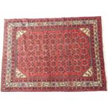 Malaya red ground woollen rug, 210cm x 155cm