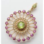 Attractive Edwardian gem set pendant, circular form centred with a round cut peridot bordered with a