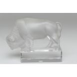 Lalique crystal glass bison paperweight, clear and frosted on a rectangular base, signed 'Lalique