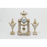 French white marble and ormolu clock garniture, circa 1900, the clock surmounted with an urn, over a