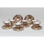 Six Royal Crown Derby demi-tasse cups and saucers, in pattern 2451, circa 1918-25