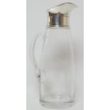 Continental silver mounted glass lemonade jug, the silver collar and spout marked 925, on a clear