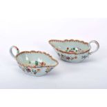 A pair of scalloped sauce boats