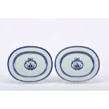 A pair of oval platters with pierced rim