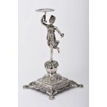 A toothpick holder "Dancer in turban holding a cup"