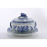 A scalloped tureen with stand