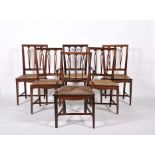 A set of twelve chairs including two armchairs