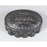 A Tin Oval Jelly Mould, Victorian, moulded with a steam train, 9ins x 6.5ins x 4.25ins high