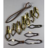 Eight Brass Nut Crackers, 18th/19th Century, some with engraved decoration and turned handles,
