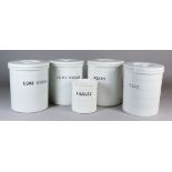 Four White Glazed Pottery Cylindrical Storage Jars and Covers and One Other Smaller Jar, Late 19th