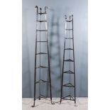 Two Wrought Iron Eight Tier Triangular Stands, with scroll terminals and feet, 13ins wide x 71ins