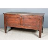 An 18th Century Panelled Stained Pine Coffer with plain lid, twin panel front on heavy square