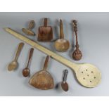 A Beech Wood Skimmer Spoon, 19th Century, and a Selection of Turned Wood Spoons and Scoops, the