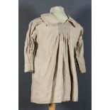 A Farmworkers Linen Smock, Late 19th Century, with fine white work embroidery to chest and back,