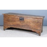 Late 17th/Early 18th Century Elm Plank Coffer, the plain lid with moulded edge, the front panel with