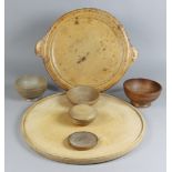 A Turned Sycamore Circular Two-Handled Platter, 19th Century, and Mixed Turned Wood Platters and