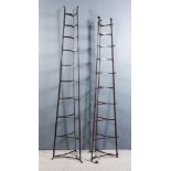 Two Wrought Iron Ten Tier Triangular Pan Stands, with scroll terminals and feet, 15ins x 77ins