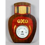 An OXO Advertising Aneroid Barometer, with wood back and aperture for calendar display, 12.25ins