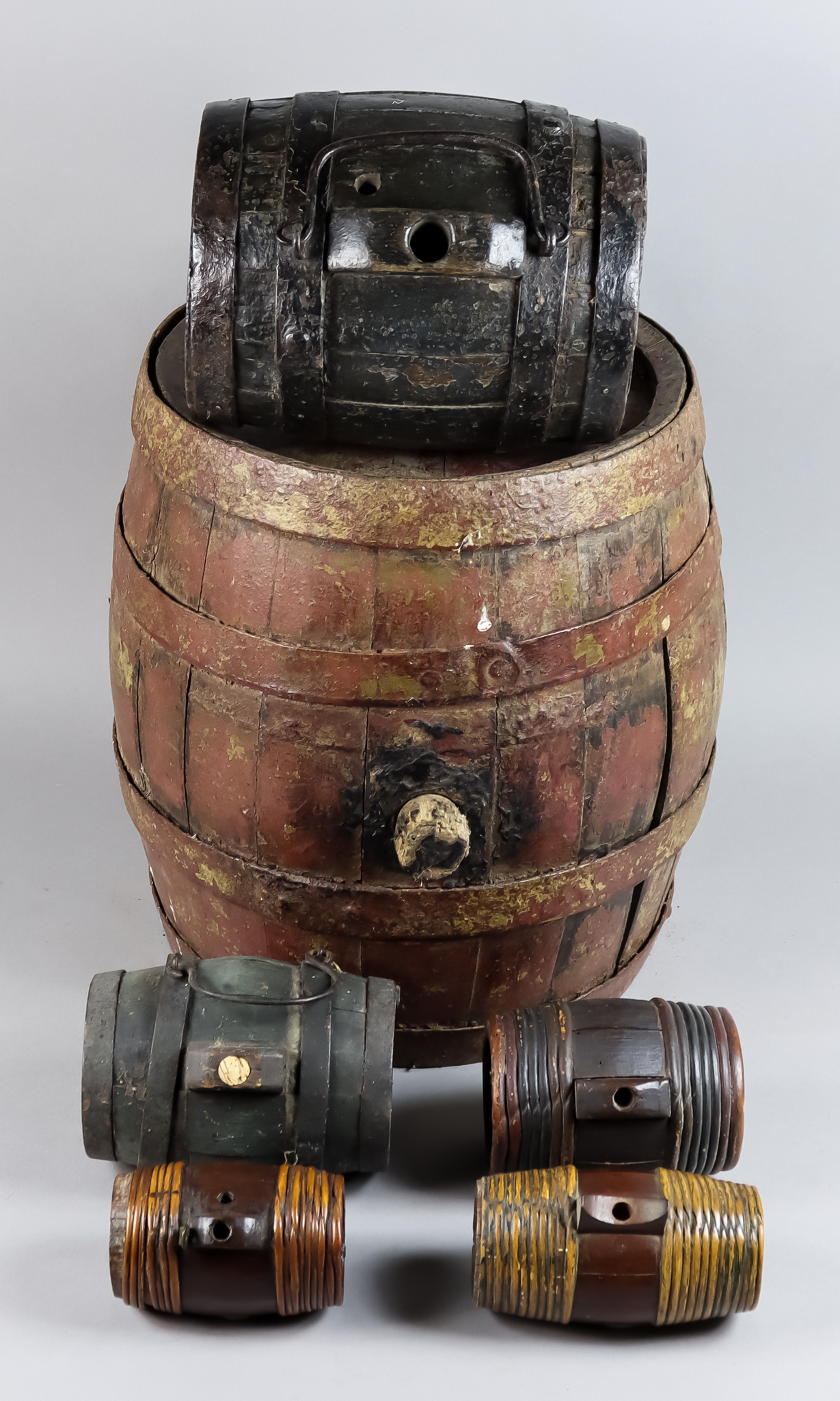 A Coopered Barrel, 19th Century, with original red paint, 11.5ins diameter x 12.75ins long, a 19th