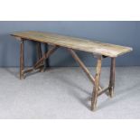 A 19th Century Pine Tavern or Kitchen Table with pitch pine two plank top, on X-pattern end