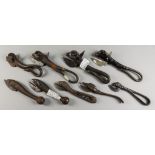 Nine Cast Iron Tin Openers, 19th Century, four cast with bulls heads and tails, largest 6.5ins