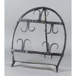 An Irish Wrought Iron Harnen Stand, 18th/19th Century, of horseshoe shape with five double