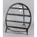 An Irish Wrought Iron Harnen Stand, 18th/19th Century, of horseshoe shape with four horizontal bars,