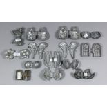 Fourteen Pewter Two-Part Marzipan Moulds, 19th Century, including two moulded with seated