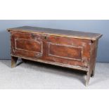 An 18th Century Pine Plank Coffer, the lid with moulded edge, the front with twin applied astragal