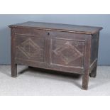 A Late 17th/Early 18th Century Panelled Oak Coffer, the plain lid with moulded edge, the two panel