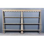 A 19th Century Cream Painted Pine Delft Rack, with narrow moulded cornice above shaped frieze,