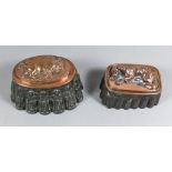Two Copper and Tinned Metal Jelly Moulds, Victorian, the oval moulded with a standing bison, 7.25ins