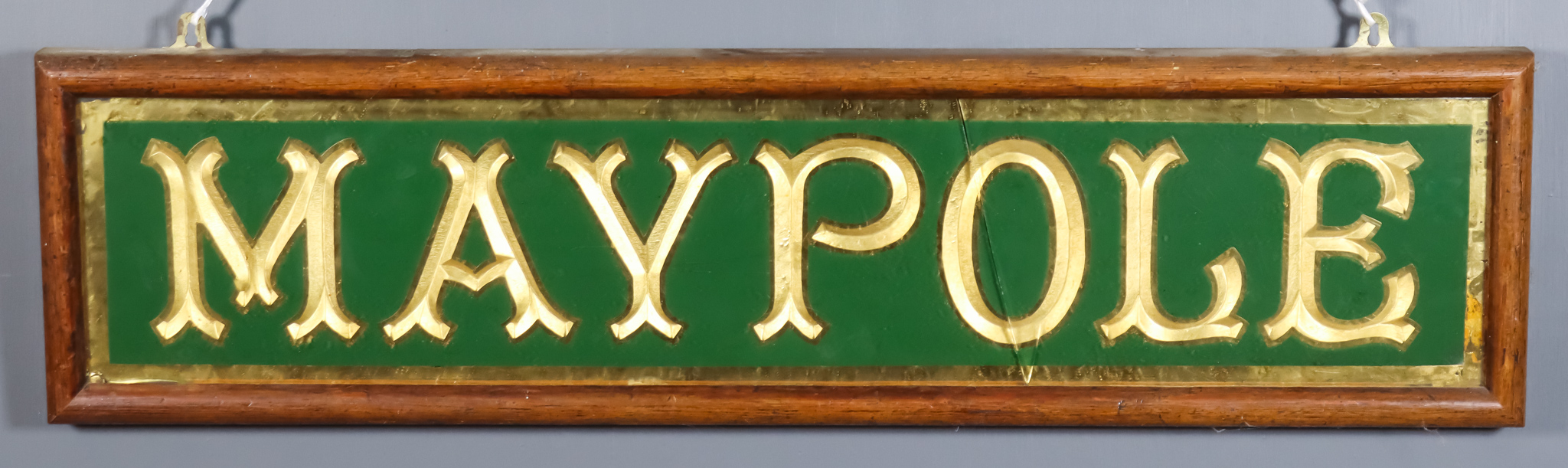 A Pine Framed Green Painted and Gilt Rectangular Advertising Panel, Late 19th/Early 20th Century,