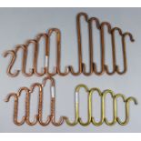 A Collection of Copper and Brass Butchers Hooks, including a set of five heavy copper hooks of plain