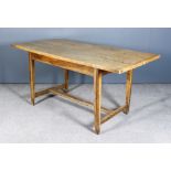 An Early 19th Century French Sycamore Topped Farmhouse Kitchen Table on elm base, the four plank