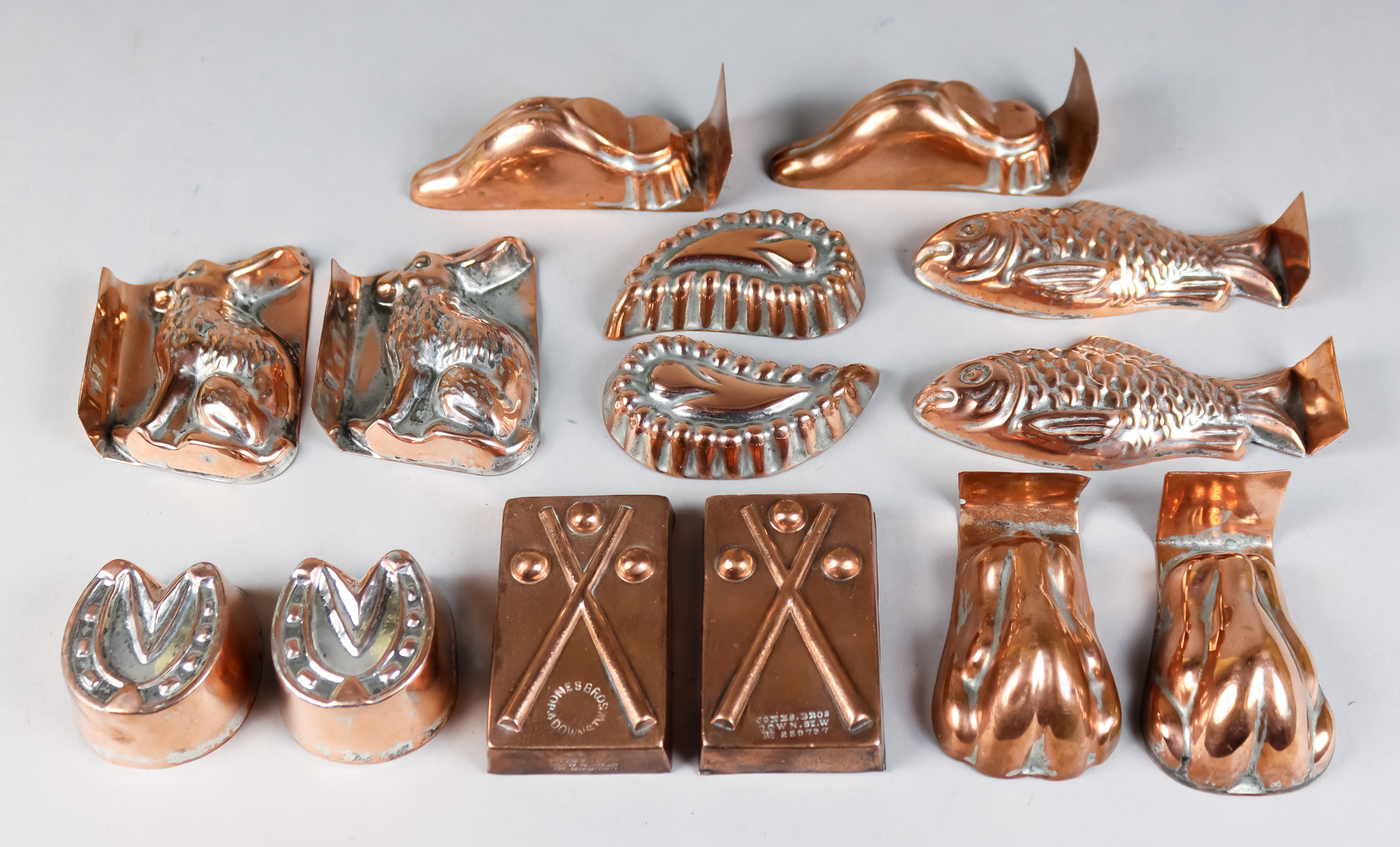 Seven Pairs of Copper Aspic Moulds, Late 19th Century, including a pair of Billiard Cue moulds, by